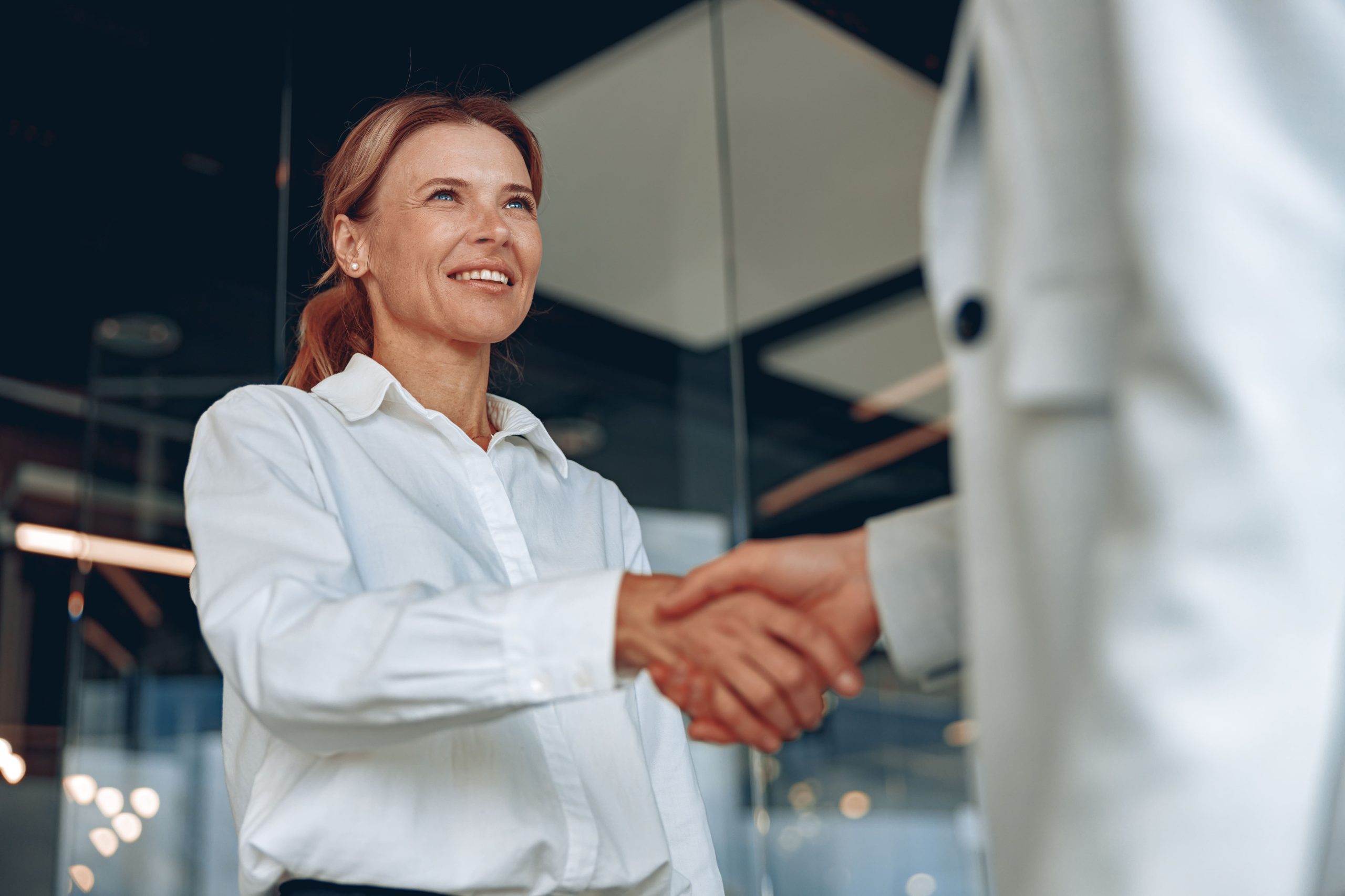 Two confident agents shaking hands